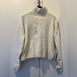 Snow white turtleneck wool sweater